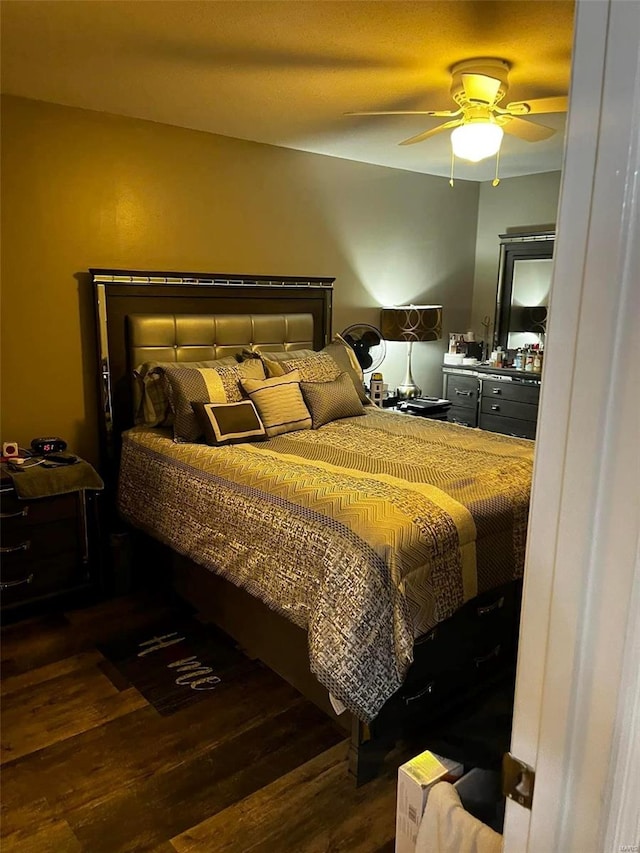 bedroom featuring hardwood / wood-style flooring and ceiling fan