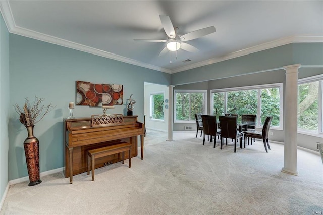 misc room with ornate columns, crown molding, ceiling fan, and light carpet