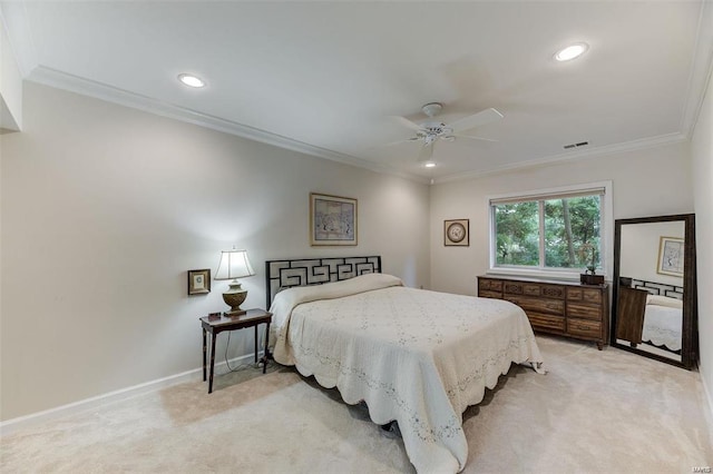 carpeted bedroom featuring ceiling fan and crown molding