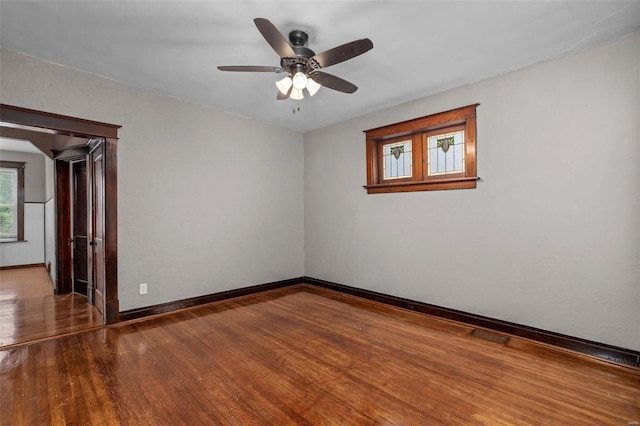 spare room featuring ceiling fan and hardwood / wood-style flooring