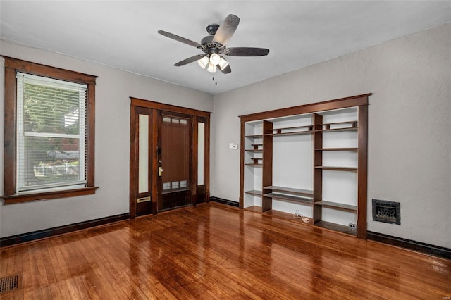 entryway with wood-type flooring and ceiling fan