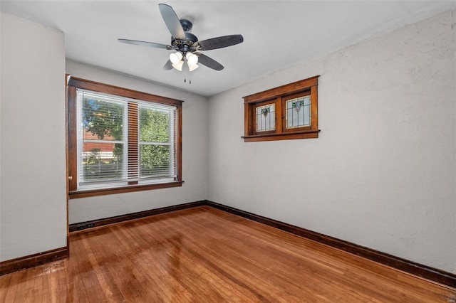 unfurnished room featuring ceiling fan and hardwood / wood-style floors