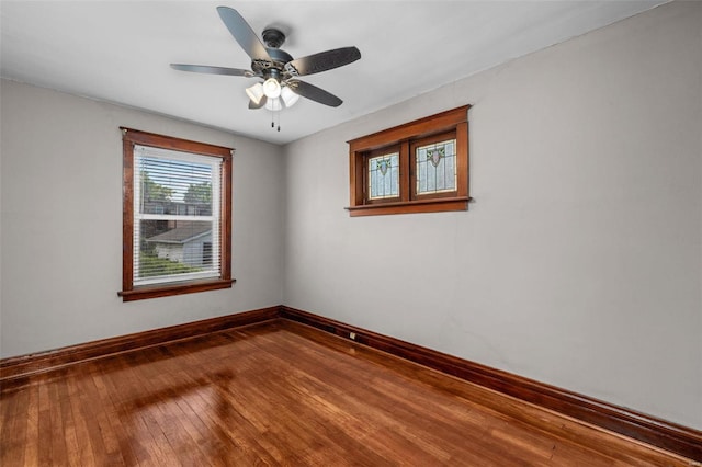 unfurnished room with hardwood / wood-style flooring and ceiling fan