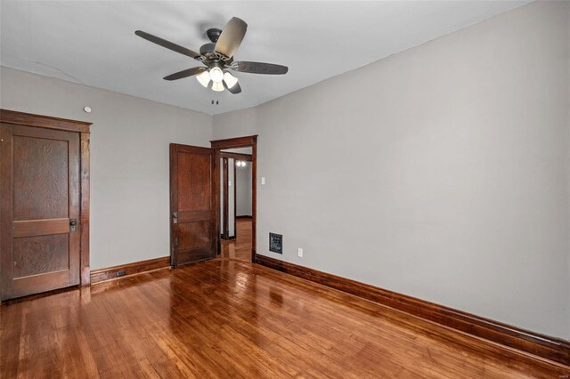 spare room featuring hardwood / wood-style flooring and ceiling fan