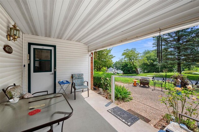 view of patio / terrace with a fire pit