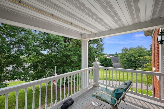 wooden terrace with a yard