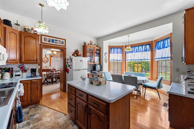 kitchen featuring pendant lighting and light countertops