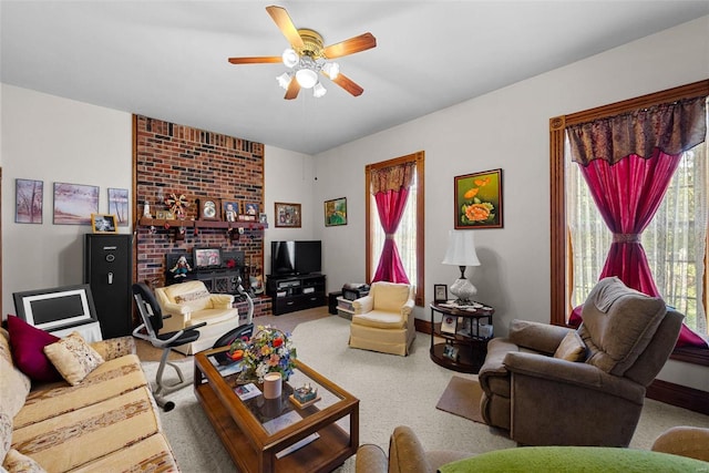 carpeted living room featuring plenty of natural light and ceiling fan