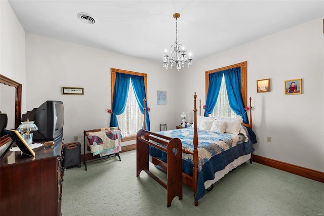 carpeted bedroom with a chandelier, visible vents, and baseboards