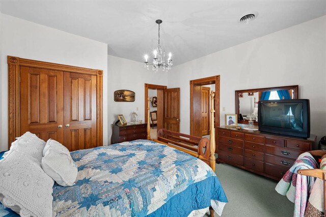 bedroom with a chandelier, a closet, light carpet, and visible vents