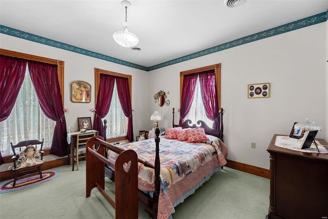 bedroom featuring light carpet, visible vents, and baseboards