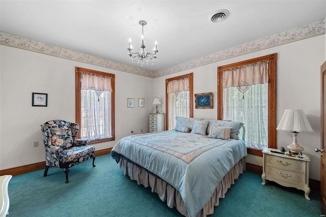 carpeted bedroom with a chandelier, visible vents, and baseboards