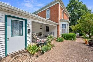 rear view of property with a patio area