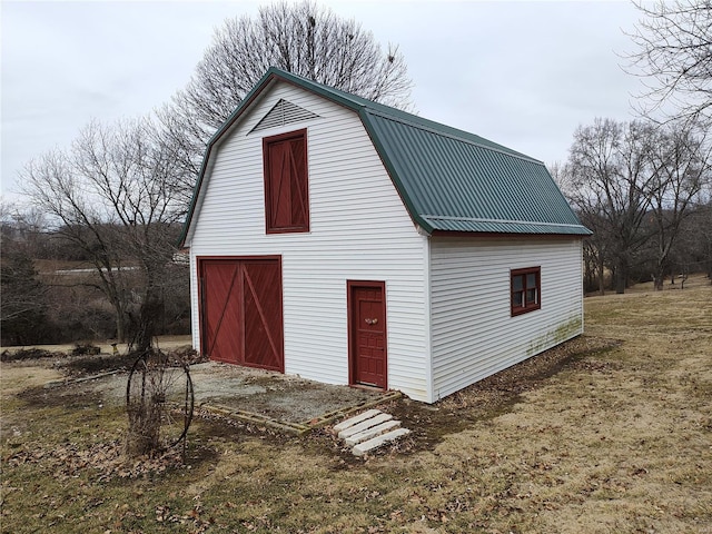 exterior space featuring driveway and a yard