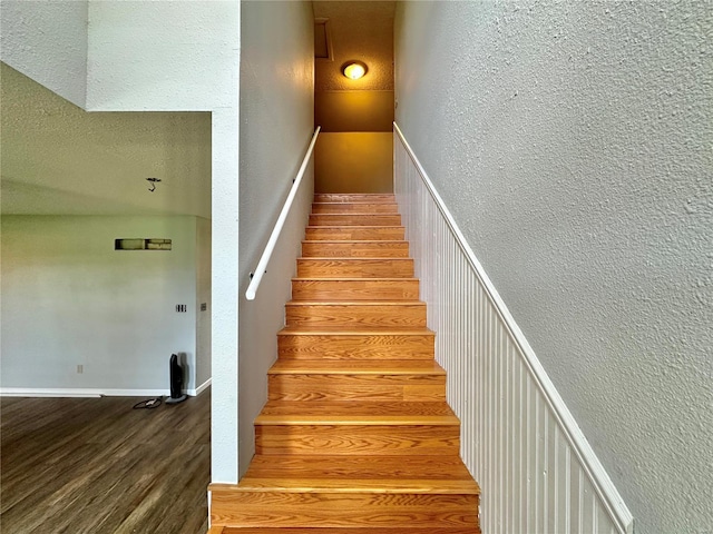 stairway featuring hardwood / wood-style flooring