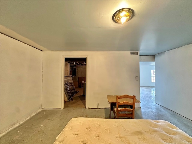 bedroom with a walk in closet and a closet