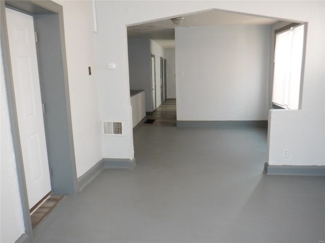 hallway featuring concrete flooring