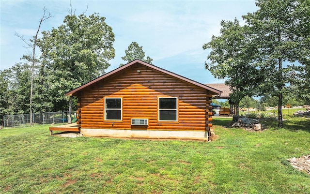 view of property exterior with a yard