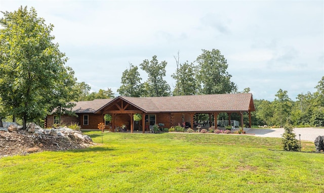 cabin with a front yard