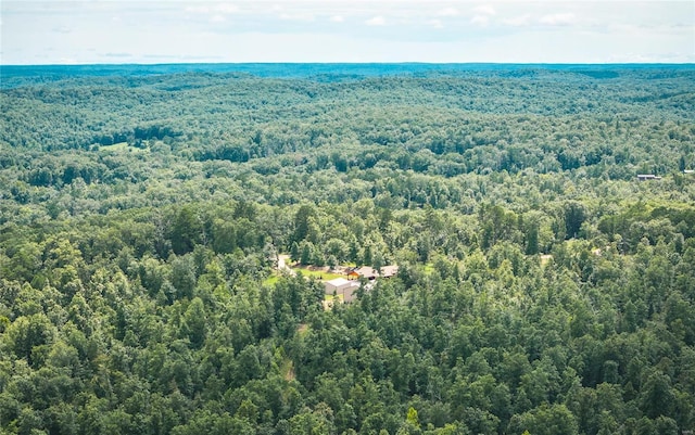 bird's eye view featuring a forest view