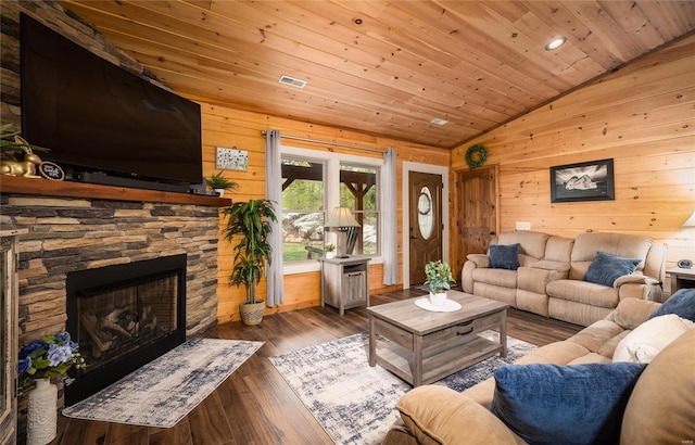 living area featuring a stone fireplace, wooden walls, wooden ceiling, lofted ceiling, and wood-type flooring
