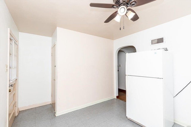 kitchen with white refrigerator and ceiling fan