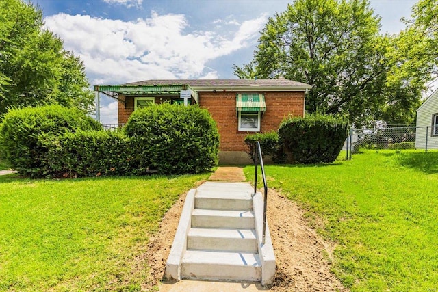 bungalow-style house with a front lawn