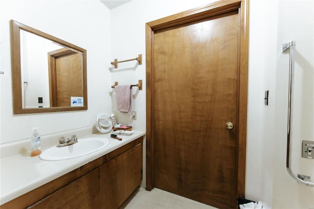 bathroom with tile patterned floors and vanity