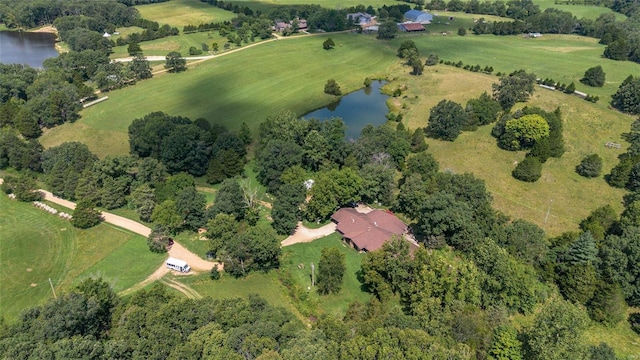 drone / aerial view featuring a water view and a rural view