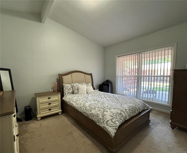 bedroom featuring light colored carpet and lofted ceiling with beams