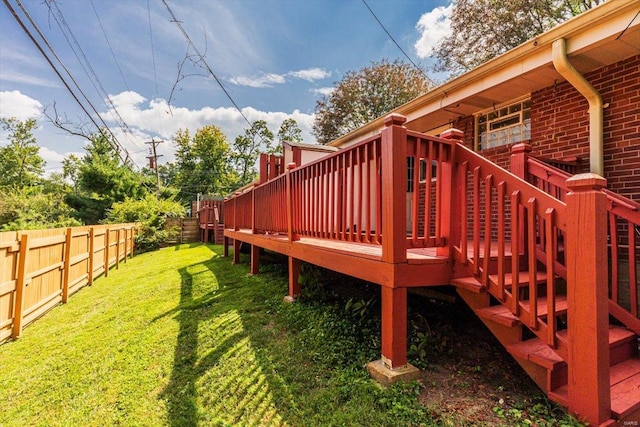 wooden deck with a lawn