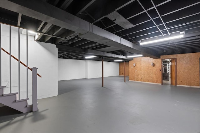 finished basement featuring stairway