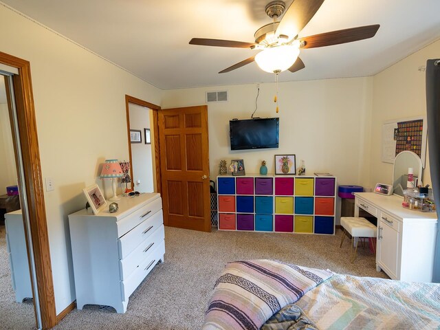 interior space featuring ceiling fan and light colored carpet