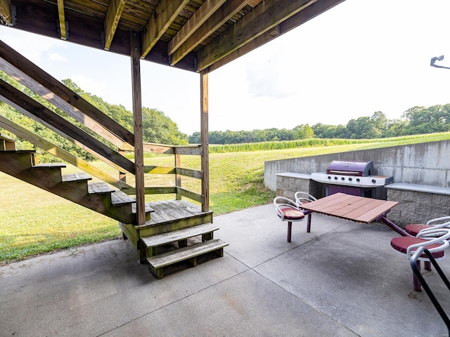 view of patio featuring grilling area and a rural view