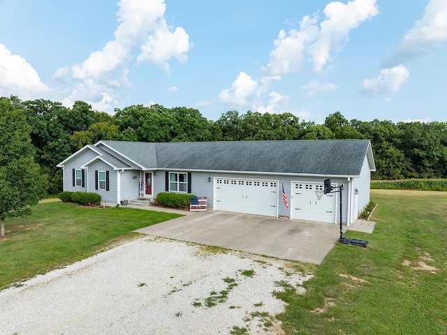 ranch-style home featuring a garage, roof with shingles, concrete driveway, and a front yard