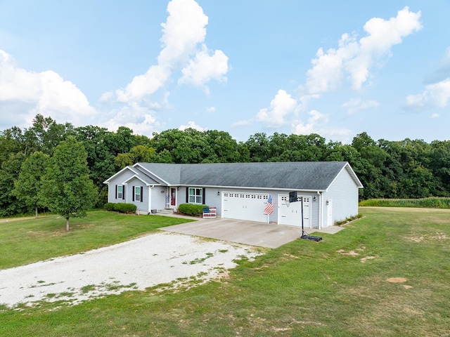 single story home featuring a garage, concrete driveway, and a front yard