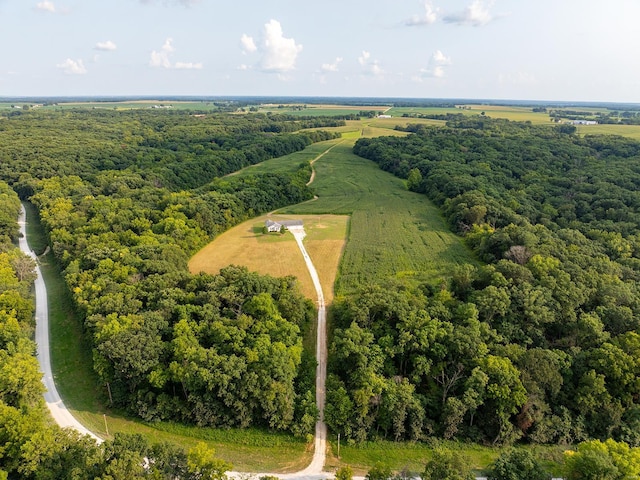 bird's eye view with a rural view and a wooded view