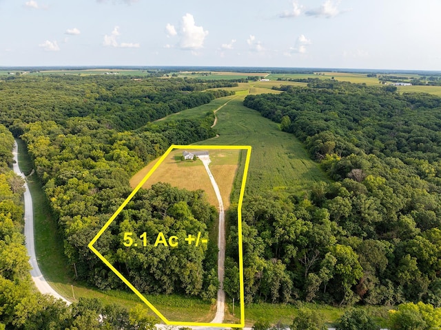 aerial view with a forest view and a rural view