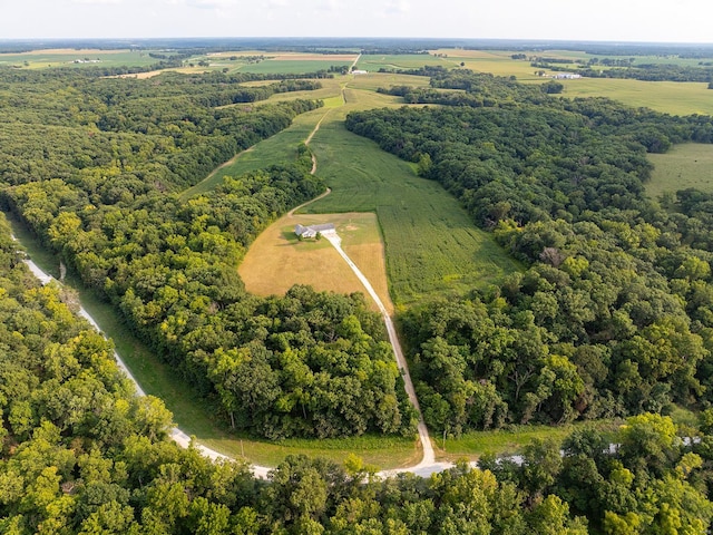 bird's eye view featuring a forest view and a rural view