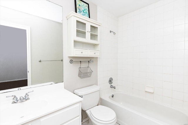 full bathroom with toilet, tiled shower / bath combo, and vanity