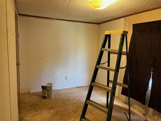 empty room with a textured ceiling