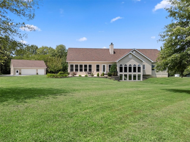 rear view of property featuring a yard