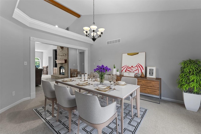 dining area featuring high vaulted ceiling, a fireplace, light colored carpet, a notable chandelier, and beam ceiling