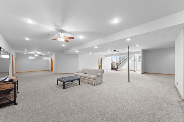 living room with ceiling fan and light colored carpet