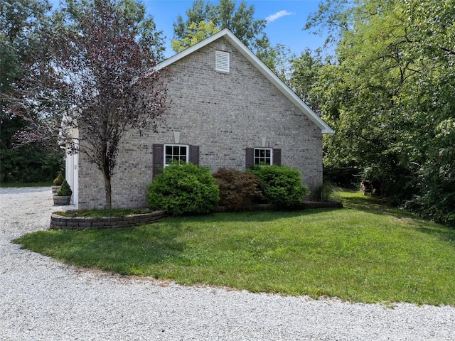 view of home's exterior with a yard