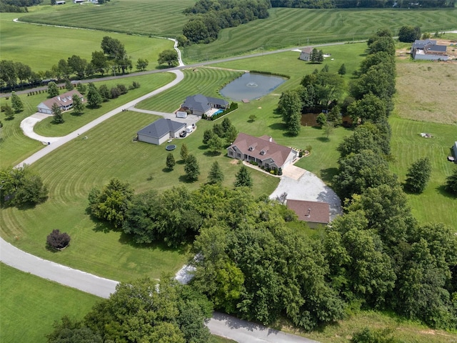 birds eye view of property with a water view and a rural view