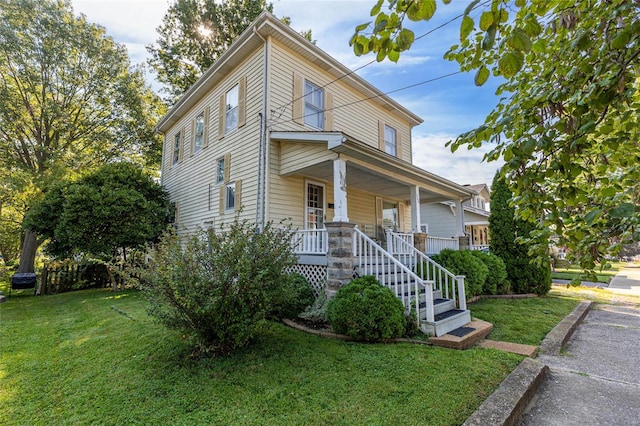 view of front of property featuring a porch and a front yard