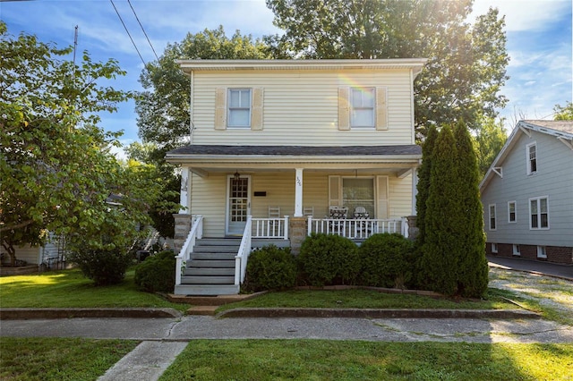 view of front of home featuring a porch and a front lawn