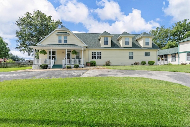 view of front of home featuring a porch and a front lawn