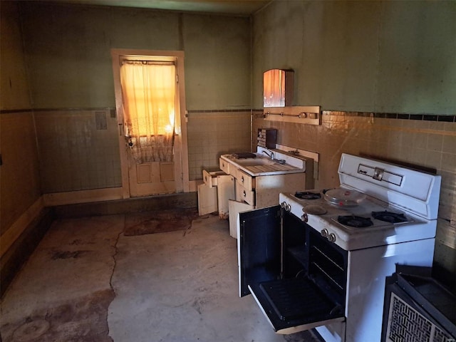 kitchen with tile walls and gas range gas stove